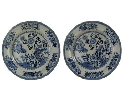 A PAIR OF LATE GEORGIAN STONE-CHINA PLATES transfer-printed in underglaze blue with chinoiserie garden scenes within floral s