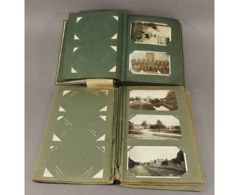 AN INTERESTING COLLECTION OF MILITARY RELATED POSTCARDS AND WORLD TOUR PHOTOGRAPHS comprising two albums of postcards, mainly