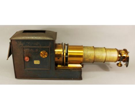 A LATE 19TH CENTURY MAGIC LANTERN PROJECTOR with large gilt brass lens apparatus, the tin body with applied label for 'Sagar 