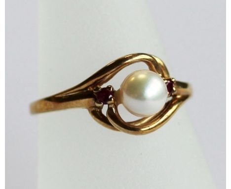 A 9CT GOLD PEARL AND RUBY RING the central pearl set within two small ruby brilliants and open scrolled surround, the shank m