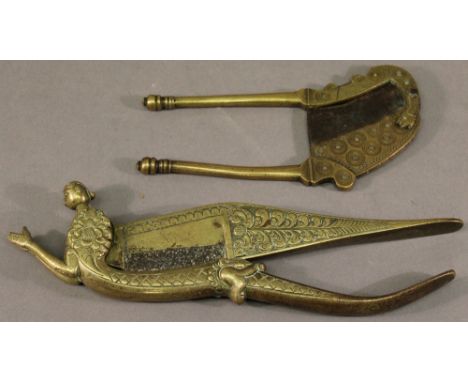TWO 19TH CENTURY INDIAN BRASS BETEL NUT CUTTERS, the first of figural/zoomorphic form with hatched and foliate decoration. 20
