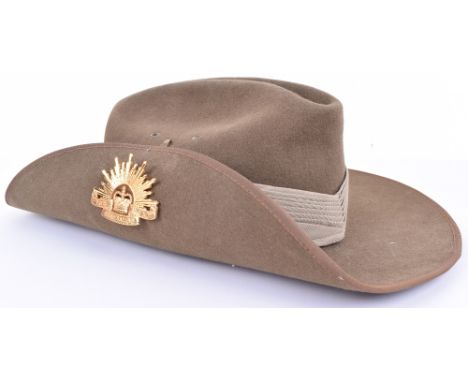 Australian Military Slouch Hat, complete with chin strap, metal badges and cloth formation badge, all in good used condition.