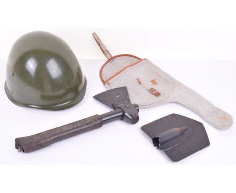 Eastern European Steel Combat Helmet, complete with liner and chinstrap. Accompanied by an Entrenching tool / axe in cloth po