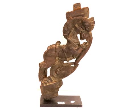 Carved Asian Beast on a metal base, H: 68 cm. P&amp;P Group 3 (£25+VAT for the first lot and £5+VAT for subsequent lots) 
