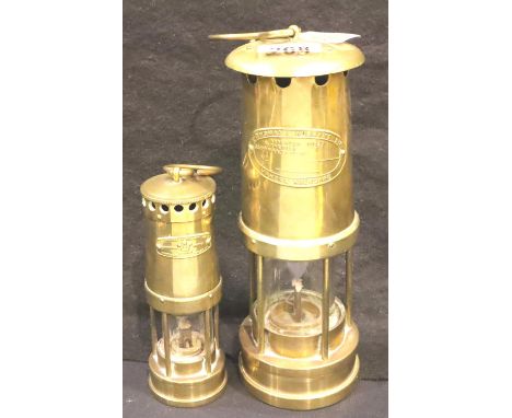 Large and small miners lamps by E Thomas Aberdare. H: 26 cm. P&amp;P Group 2 (£18+VAT for the first lot and £3+VAT for subseq