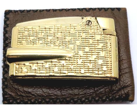 9ct gold bound Ronson varaflame lighter, working at lotting, gross weight 70g. P&amp;P Group 1 (£14+VAT for the first lot and