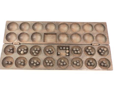 Ebony box with wooden ball contents, L: 41 cm. P&amp;P Group 3 (£25+VAT for the first lot and £5+VAT for subsequent lots) 
