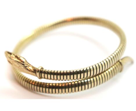 A yellow metal sprung articulated snake form bangle, marked Germany, 15g. P&amp;P Group 1 (£14+VAT for the first lot and £1+V