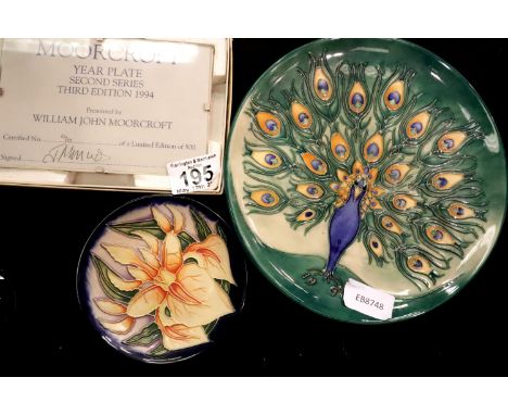 Moorcroft Peacock plate 96/500, Iris pattern pin dish and a boxed Moorcroft presentation plaque, D: 22 cm. P&amp;P Group 2 (£