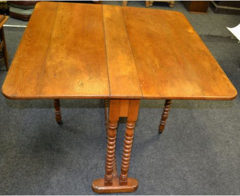 A mid 20th century light oak Sutherland table, bobbin turned supports 