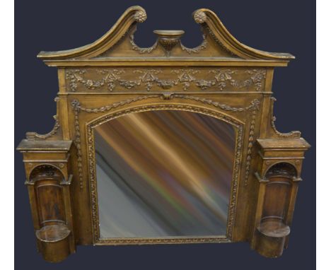 A large Victorian carved wood and gesso architectural overmantel, bold cresting above mirror plates and niches, c.1880