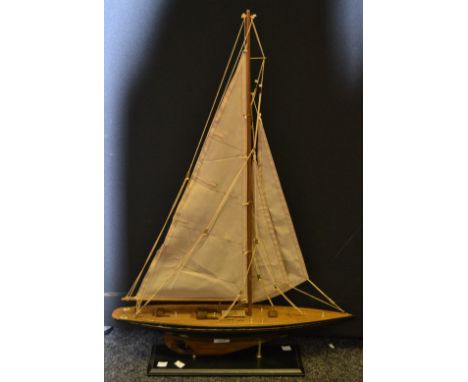 A model of a yacht, ebonised plinth, 83cm high