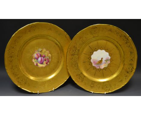 A pair of Royal Worcester cabinet plates, one painted with a Grouse amongst heather, signed A R Whatmore, the other with ripe