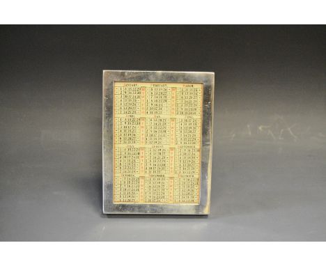 An Edwardian silver rectangular easel desk calendar, quite plain, 11cm high, Stuart Clifford & Co, London 1906