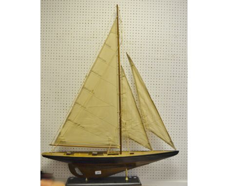 A model of a yacht, ebonised plinth, 118cm high