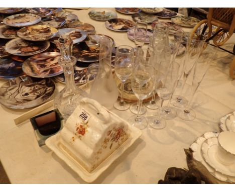 Collection of glass including champagne flutes and crystal decanter cheese dishes with covers etc 