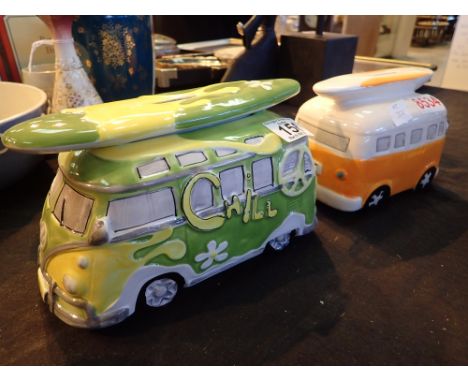 Two ceramic money boxes in the form of  VW surfer vans