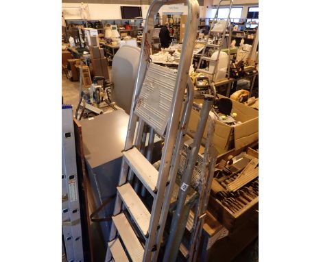 Two sets of metal step ladders