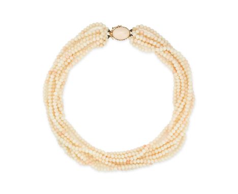 NO RESERVE - A CORAL BEAD NECKLACE in 18ct yellow gold, comprising eight rows of round light pink coral beads, the clasp set 
