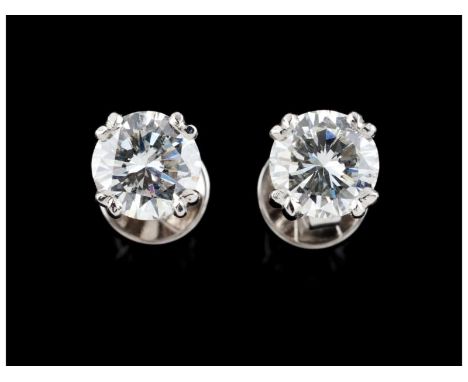 A pair of stud earringsGold Set with two brilliant cut diamonds totalling (ca. 2.50ct) possibly colour J/K clarity vvs and vs