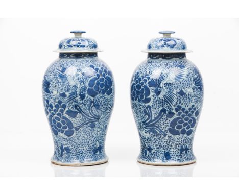 A pair of pots and coversExport porcelainPhoenix and flowers decoration in the Kangxi tasteChina, 19th centuryHeight: 45 cm 