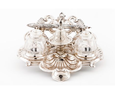 An inkwellPortuguese silverScalloped shell shaped base of relief flowers and volutes decorationCut glass inkwell and sand pot