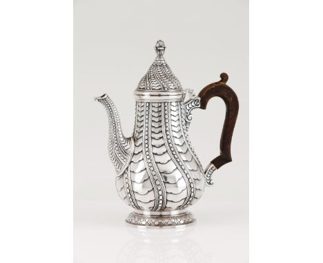 A coffee potPortuguese silverSpiralled decoration of fish scale like motifs alternating with beaded friezesDomed cover of ide