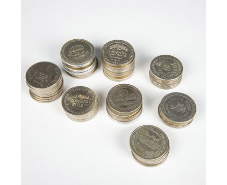 This collection includes vintage tokens from various casinos. Most tokens are similar in size, with an approximate diameter o