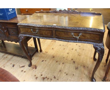 Burr walnut two drawer console table on cabriole legs, 85cm high by 106cm wide.
