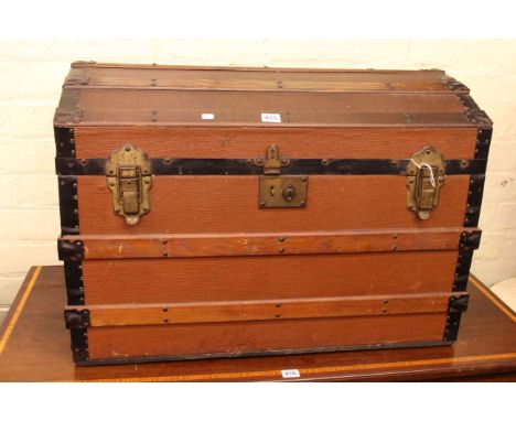 Vintage wood and metal bound dome trunk and wicker laundry basket.