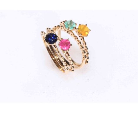 Four matching 9k gold rings set with sapphire, ruby, emerald and opal.