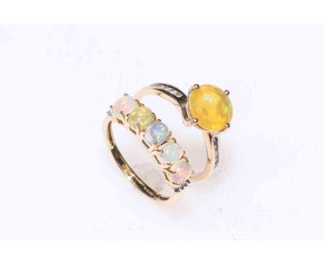 Two 9k gold opal rings.