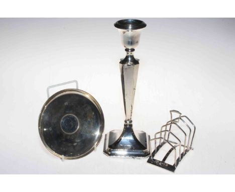 Art Deco silver toast rack, Birmingham 1936, silver Churchill shallow dish, and loaded candlestick.