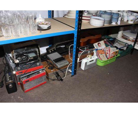 Two guitars, vintage portable television, vintage radios, LP and single records, Rotel tuner, etc.