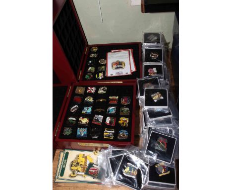 Collection of Danbury Mint enamel pin badges with two presentation boxes.