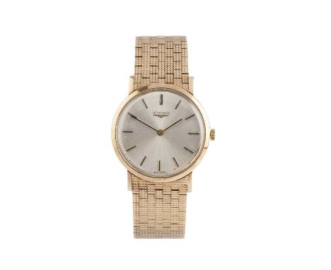 A 9ct gold bracelet watch, the circular silvered dial with baton markers, signed LONGINES, to a jewelled manual wind movement