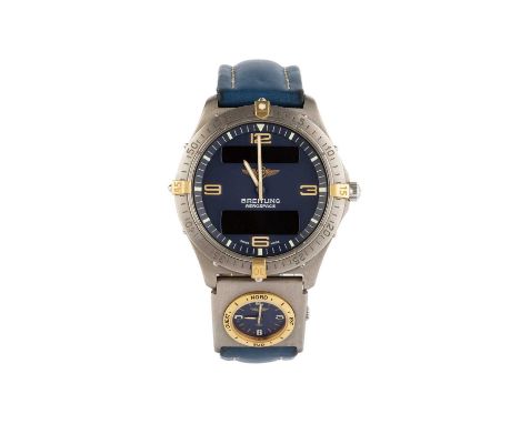 A titanium 'Aerospace' wristwatch by Breitling, the circular blue dial with gilt Arabic quarters, luminous baton outer scale,