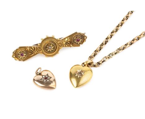 A diamond set heart pendant, of hollow design, 15ct gold mounted (hallmarks rubbed), suspended from a fancy-link chain stampe