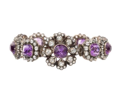 An amethyst set panel bracelet, designed as a line of articulated cushion-shaped amethyst and white stone cluster links, encl