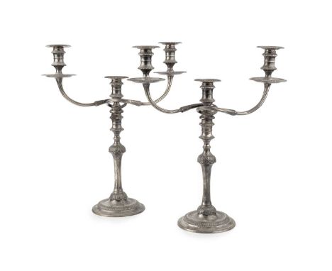 A pair of silver three light candelabra, each with fluted knopped stems and circular bases, with detachable reeded branches a