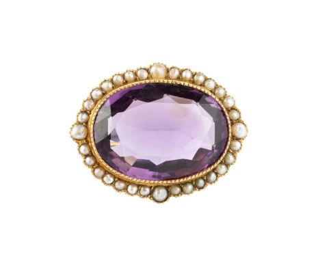 A late 19th/early 20th century amethyst and half pearl cluster brooch, the oval mixed-cut amethyst in millegrain collet setti
