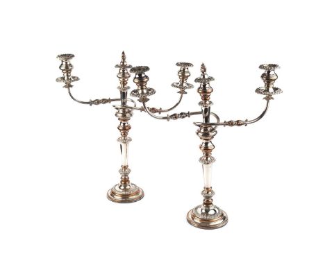A pair of 19th century Sheffield plate twin branch three light candelabra, each with knopped stem and reeded twin branches, w