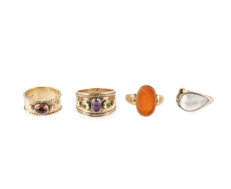 An Edwardian carnelian single stone dress ring, with foliate scroll engraved shoulders, 15ct gold mounted, hallmarked for Che