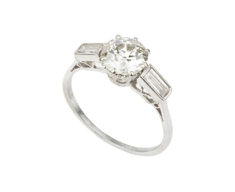 A diamond single stone ring, the old-cut diamond in eight-claw setting, between baguette-cut diamond set shoulders, above a p