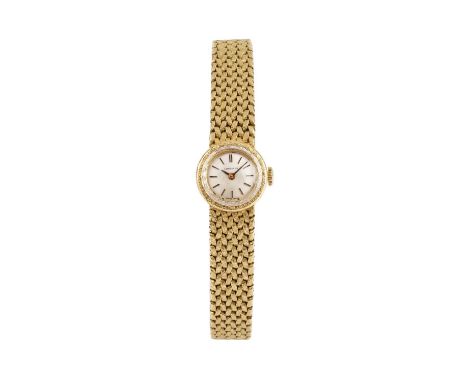 A lady's bracelet watch by Longines, the circular silvered dial with baton markers, to a calibre 320 jewelled manual wind mov