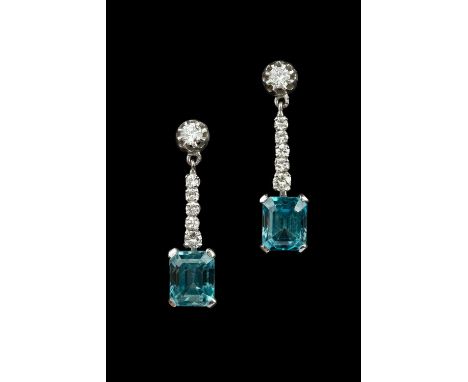 A pair of blue zircon and diamond ear pendants, each rectangular step-cut blue zircon in claw setting, surmounted by a line o