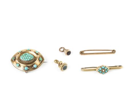 A Victorian turquoise set panel brooch, the navette-shaped panel centred with a bombé cluster of turquoise cabochons, with ro