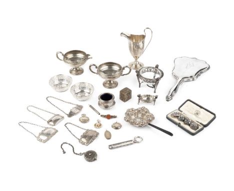 A collection of silver, comprising a helmet shaped cream jug by Charles Edwards, London 1928, an American twin handled sucrie