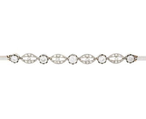 A diamond panel bracelet, designed as a series of openwork navette-shaped panels, millegrain set with old and lasque-cut diam