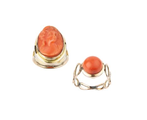 Two coral dress rings, the first a cameo ring, the oval coral corallium rubrum cameo carved to depict a classical female port